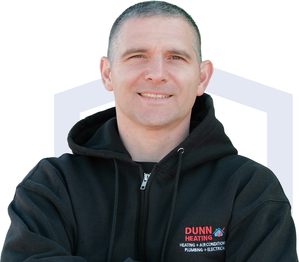 Dunn team member in his white uniform, smiling broadly with teeth visible. Dunn team member in his white uniform, smiling broadly with teeth visible.